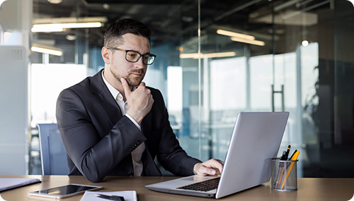 Image representing a business person reading a online document with attention