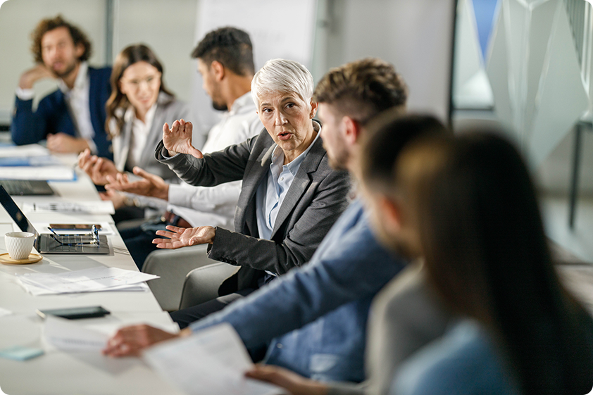 Group of business people working together on a plan to alleviate danger in the workplace