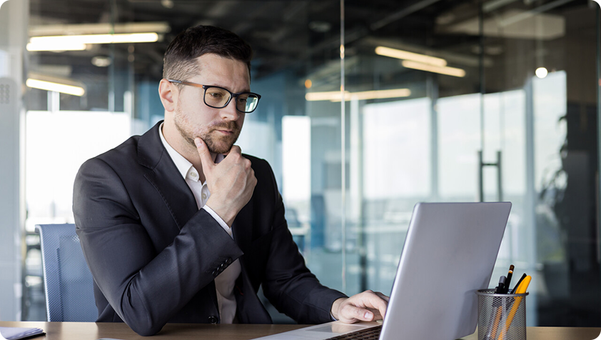 Image representing a business person reading a online document with attention